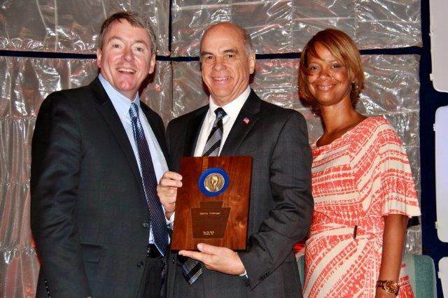 Photo caption: Dennis Flickinger (center) receiving the William W. Pratt Lifetime Achievement Award for the 2015 Credit Union Professional of the Year from PCUA President & CEO Patrick Conway and PCUA Board Chair Maria LaVelle.