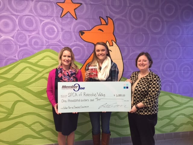 Caroline LaCroix, Community Relations Coordinator at Member One Federal Credit Union, Lexi Stull, winner of the Member One FCU Holiday Coloring for a Cause contest and Denise Hayes, Executive Director for the Roanoke Valley SPCA