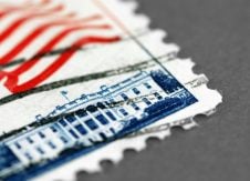 USPS makes history, cutting stamp prices 2¢. But does it matter?