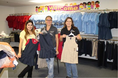 Margaret Hunnicutt drop off 150 Uniforms to Connecting with Kids Children’s Charity.