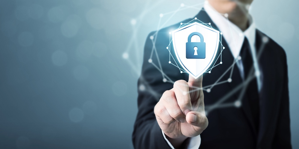 Businessman touching shield protect icon Concept cyber security safe your data