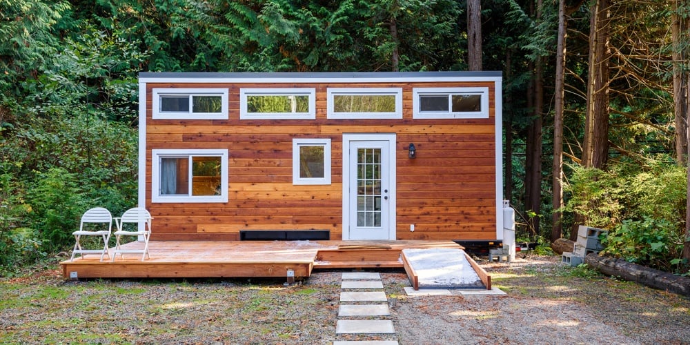Small wooden rustic cabin house. Exterior design.