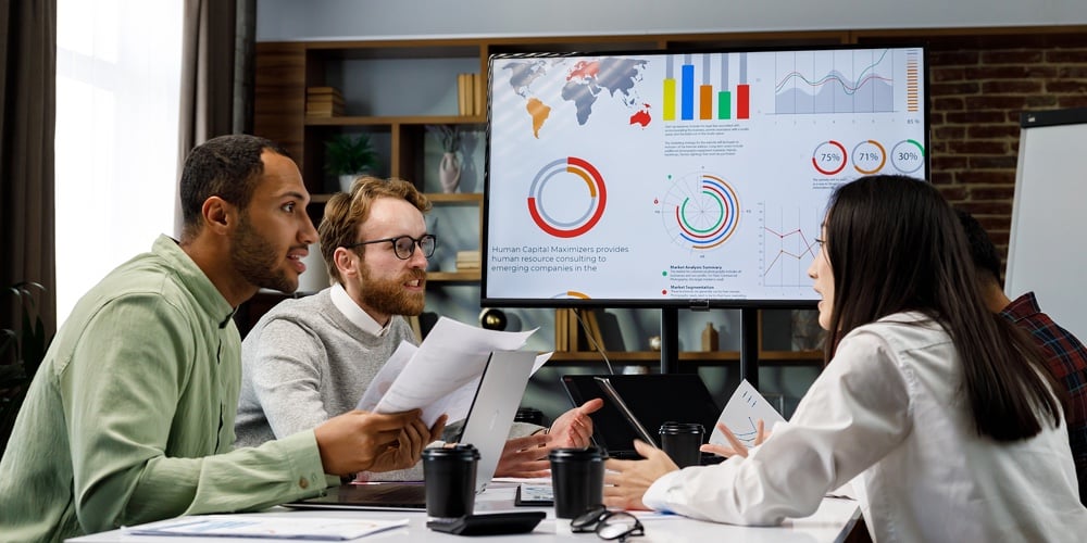 A Team Of Young Mixed Race Businessmen Working On A Startup. Business Strategy