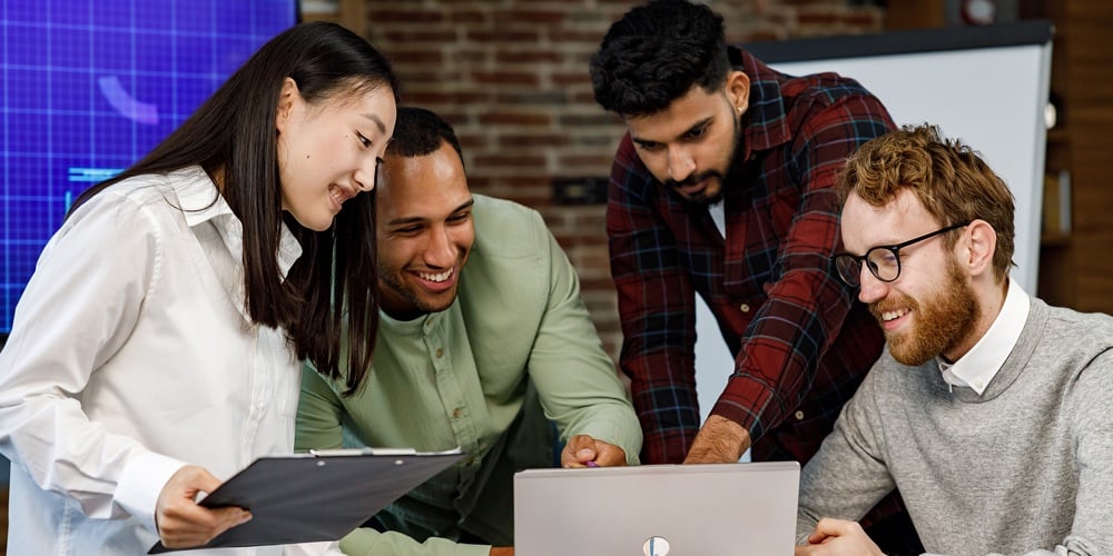 A Team Of Young Multinational Business People Are Working On A Startup. New Generation Of Startups.