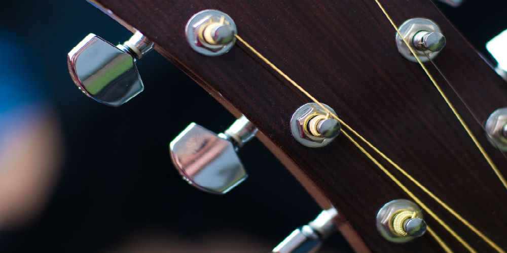 bigstock-Acoustic-Guitar-Tuning-Pegs-82472381