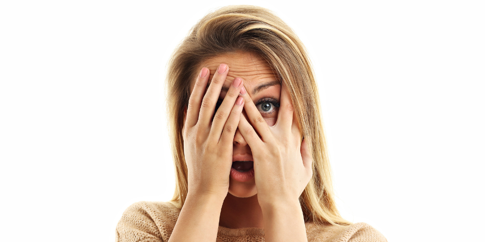 bigstock-Afraid-woman-looking-at-camera-178140877