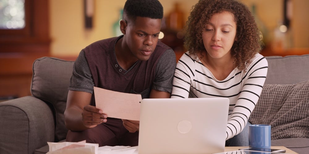 bigstock-African-American-Couple-Pays-T-168239372