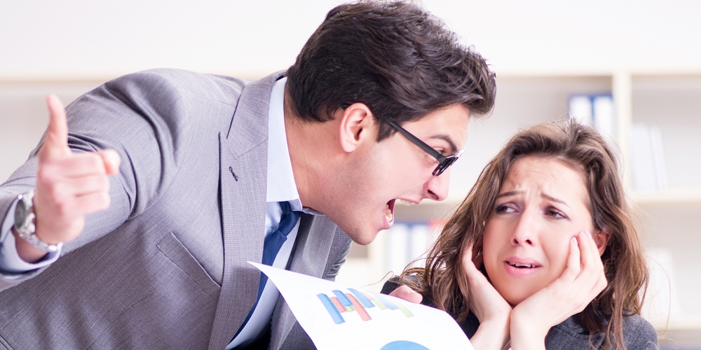 Angry boss unhappy with female employee performance
