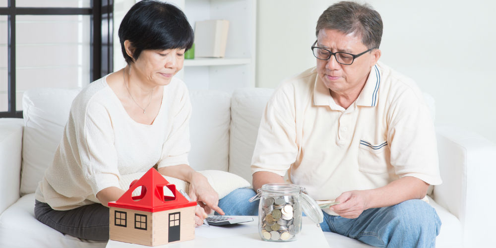 bigstock-Asian-senior-couple-counting-o-97055288