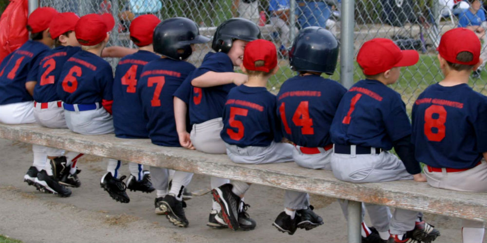 bigstock-Baseball-Team-On-Bench-21541