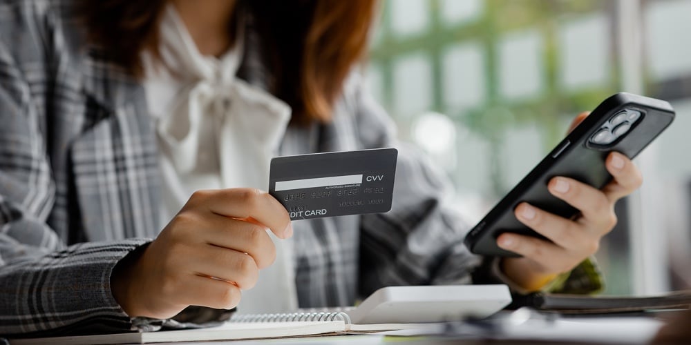 Beautiful Woman Holding A Credit Card