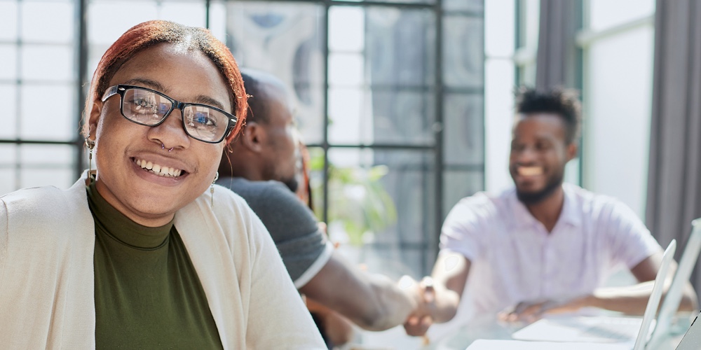 Beautiful Young Grinning Professional Black Woman In Office