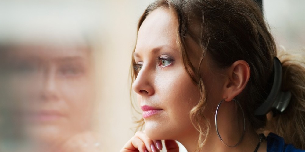 bigstock-Beautiful-woman-looking-throug-20311445-e1454080891165