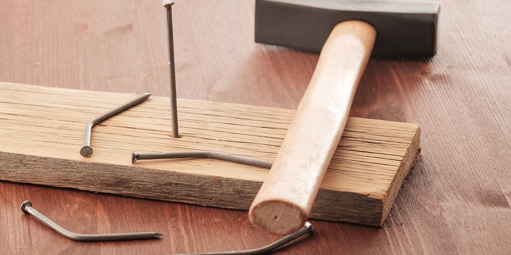Wooden Plank With One Bent Nail