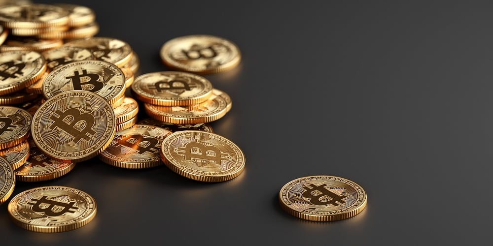 Bitcoin Crypto currency coins. BTC Gold bitcoin Bit Coins bitcoins on dark background. Bitcoins mini