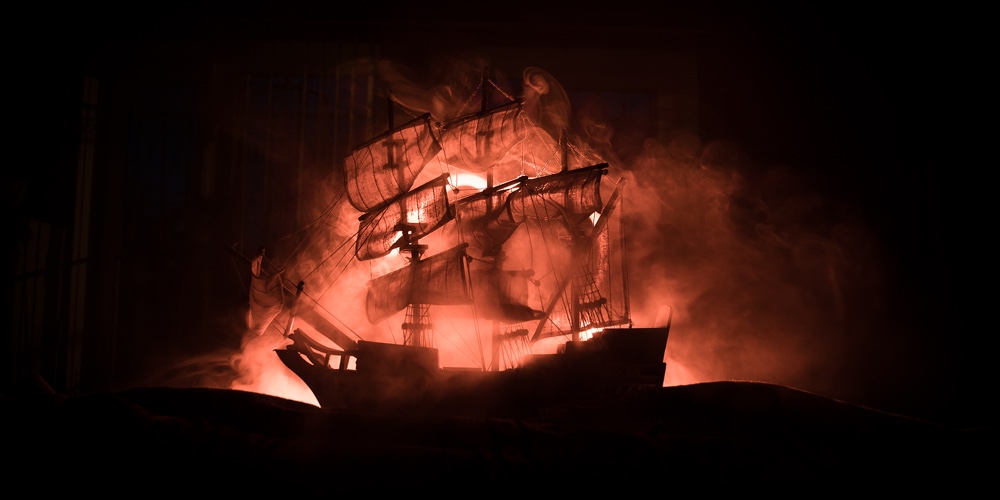 Black Silhouette Of The Pirate Ship In Night