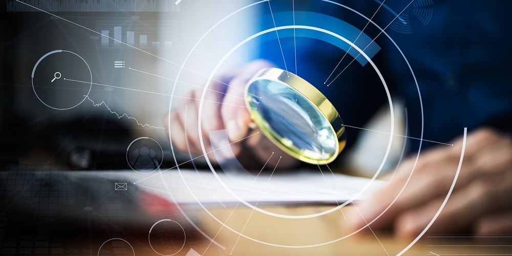 Business Auditor Using Magnifying Glass For Paperwork Fraud Investigation