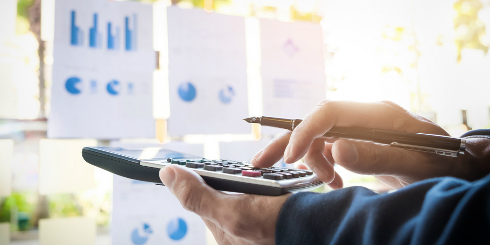 bigstock-Business-Finance-Man-Calculati-172484819