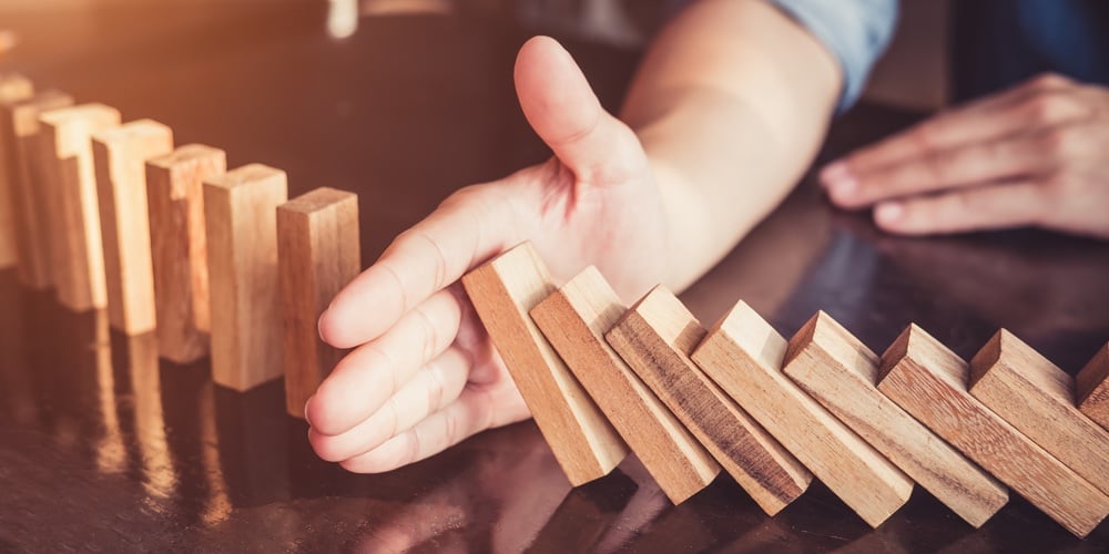 Business Man Placing Wooden Block On A Tower Concept Risk Control