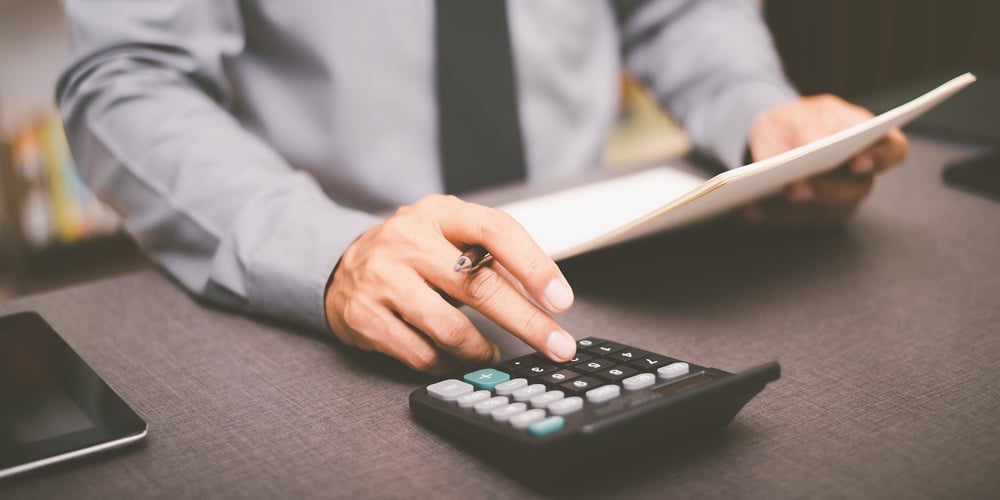 Business People Use Calculator To Calculate Documents