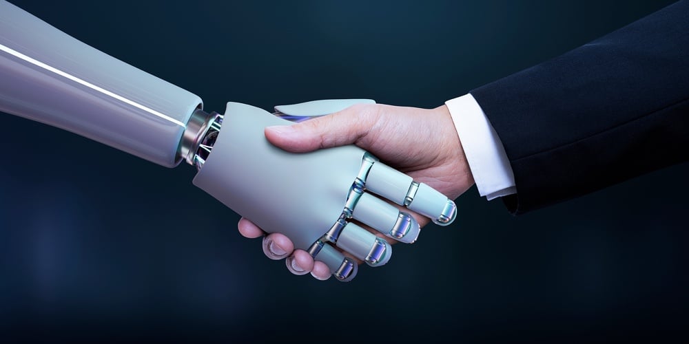 bigstock-Business-hand-robot-handshake-436873724