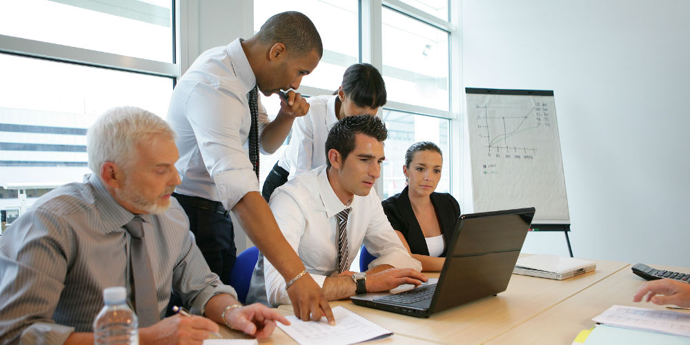 bigstock-Two-Business-Woman-Analyzing-B-70748713