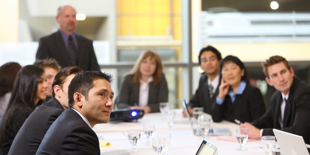 Business people in board room meeting