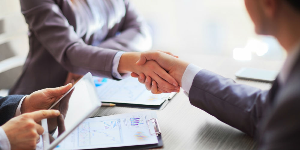 bigstock-Business-people-shaking-hands-834455301