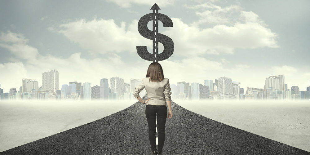 bigstock-Business-woman-on-road-heading-99598130