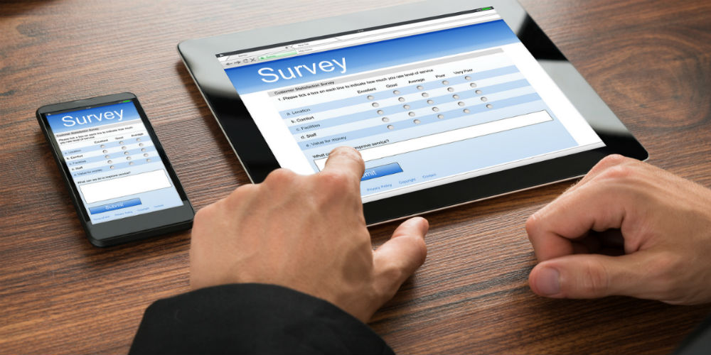 bigstock-Businessman-Filling-Survey-For-93177587