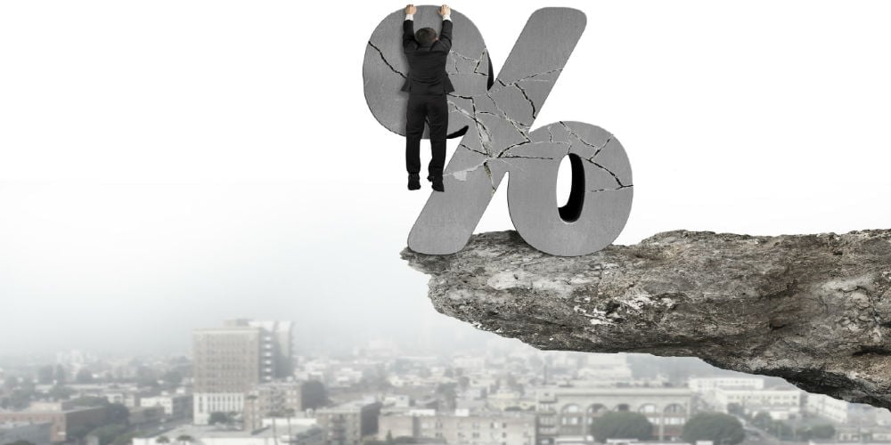 bigstock-Businessman-Hanging-On-Cracked-85422512