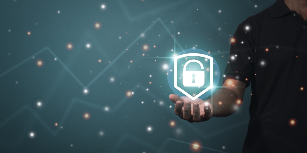 Businessman Holding A Shield With A Padlock On A Worldwide Networking Connection