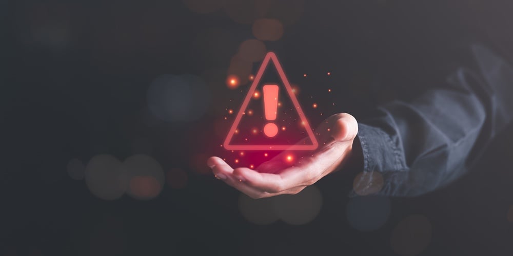 Businessman Showing Warning Icon