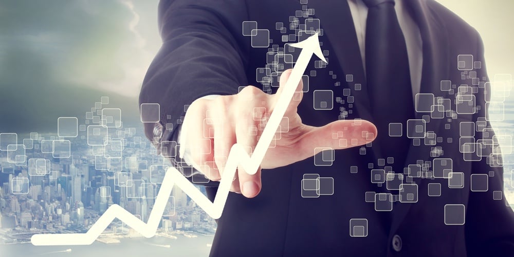 Businessman Touching A Chart Indicating Growth|Businessman Touching A Chart Indicating Growth