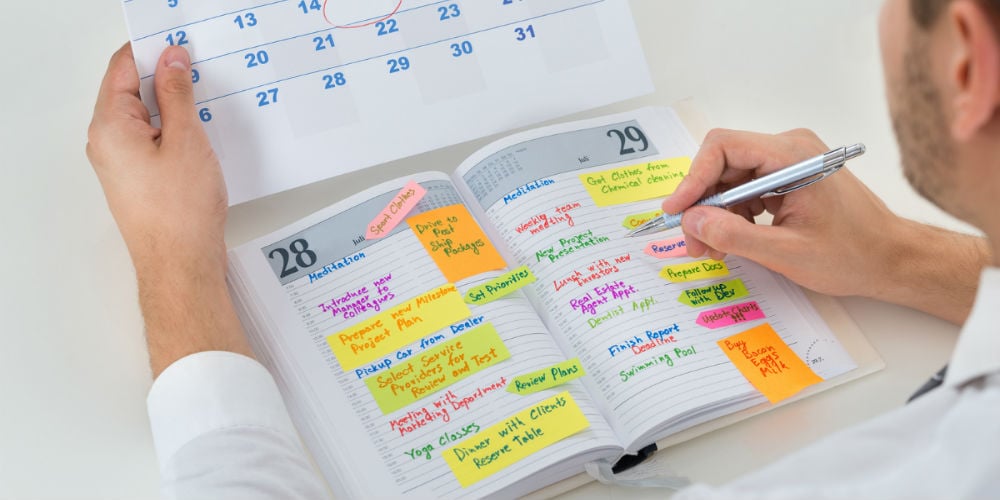 bigstock-Businessman-With-Calendar-And-104962622