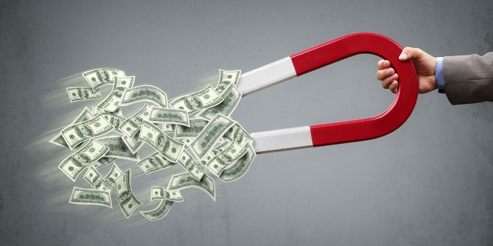bigstock-Businessman-attracting-money-w-76257857