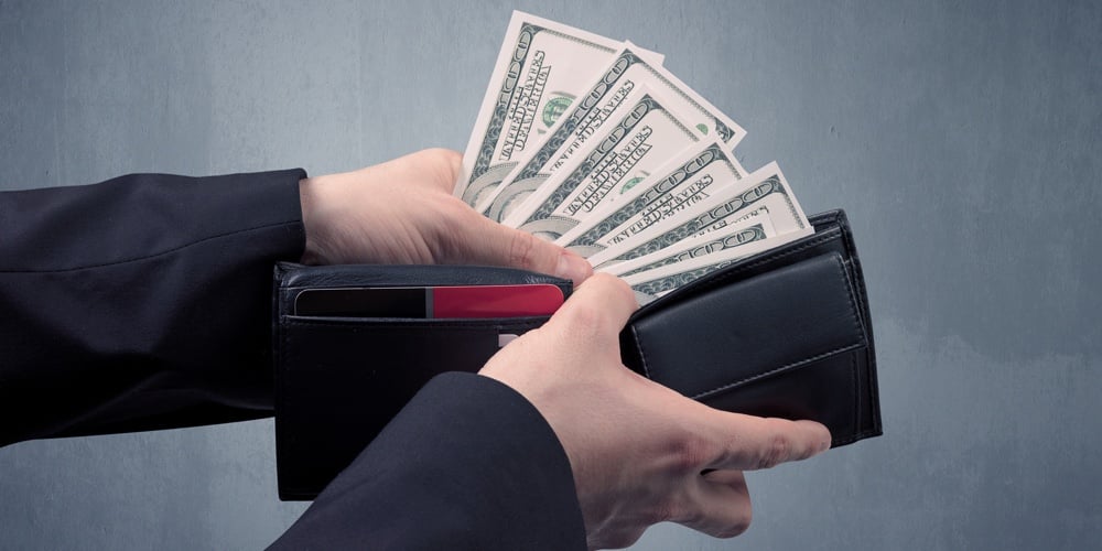 bigstock-Businessman-s-hand-in-suit-tak-220987822