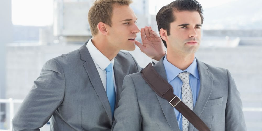 bigstock-Businessman-telling-secret-to-90565679