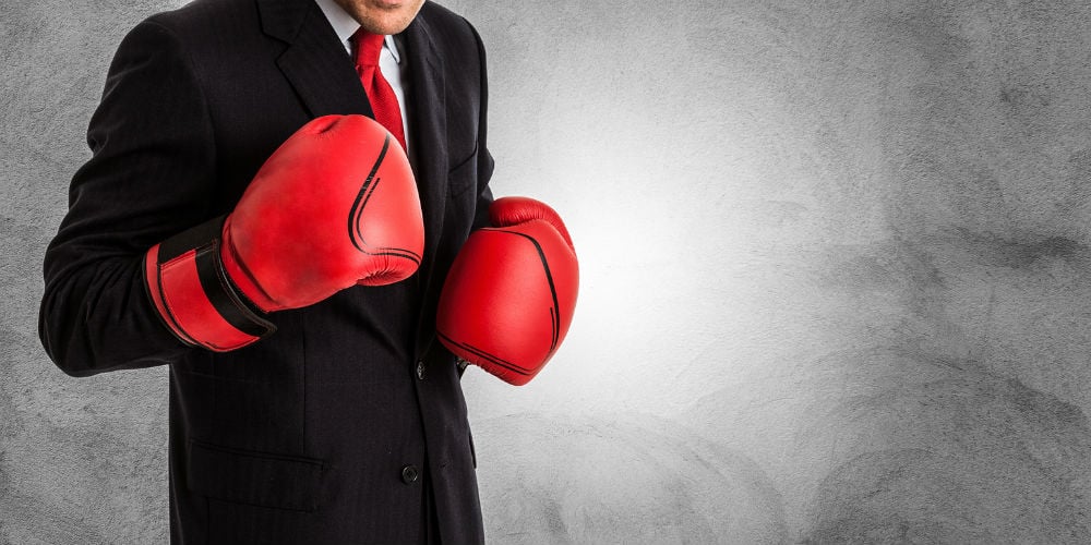 bigstock-Businessman-with-boxing-gloves-104003585