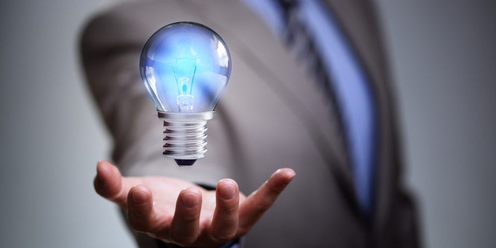 Businessman with illuminated light bulb concept for idea