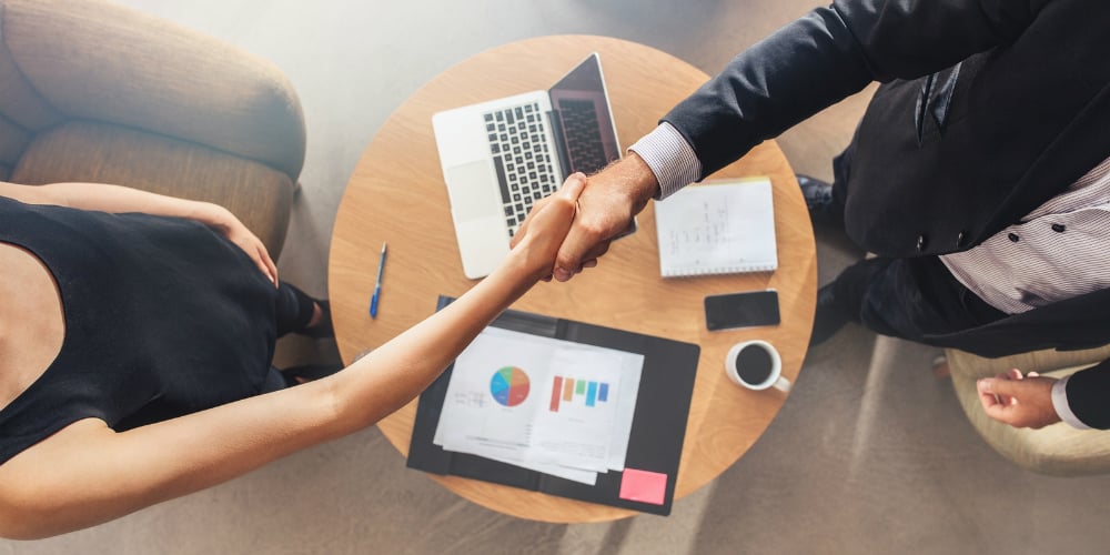 bigstock-Businesspeople-Shaking-Hands-A-147803351