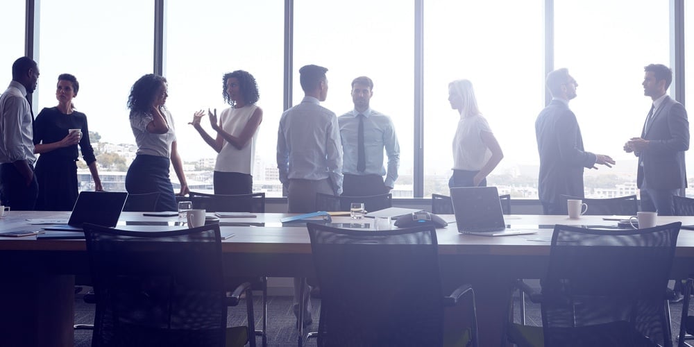 bigstock-Businesspeople-Stand-And-Chat-184926076