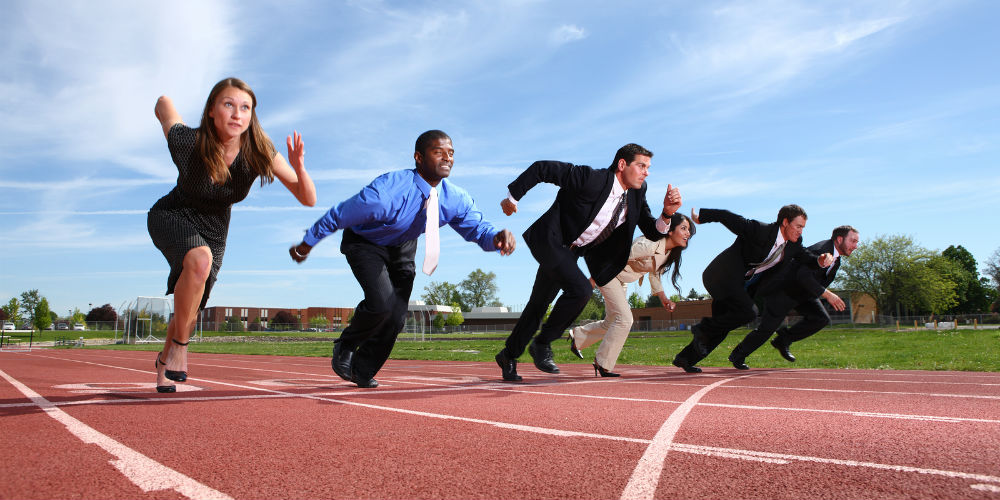 bigstock-Businesspeople-race-on-track-14086043