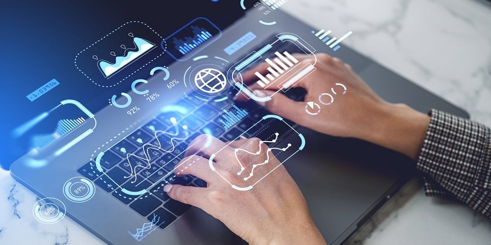 Businesswoman Working On Business Dashboard With Charts