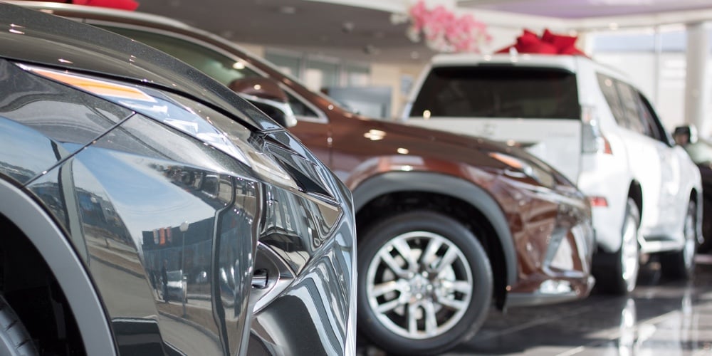 bigstock-Car-Auto-Dealership-Themed-Bl-239822206
