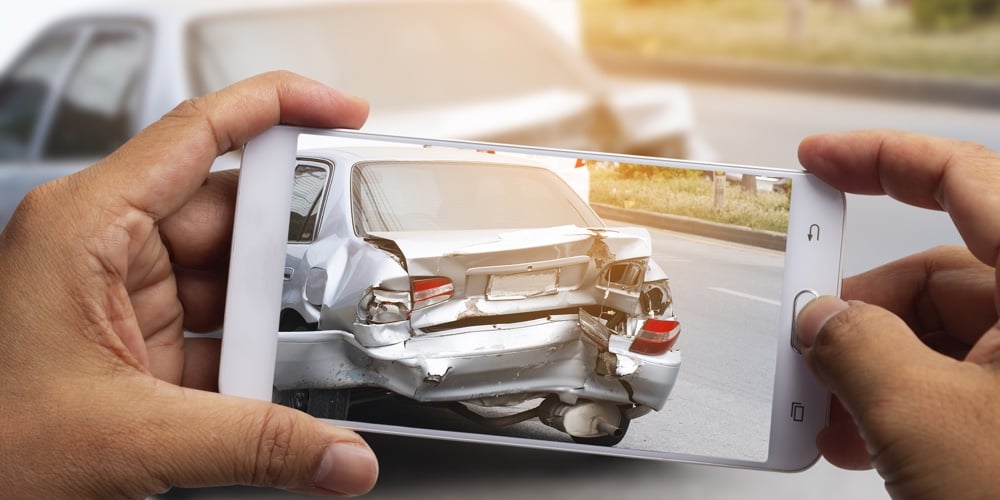 Car Insurance Agents Take Pictures Of Accident-damaged Vehicles With A Smartphone As A Proof Of Insu
