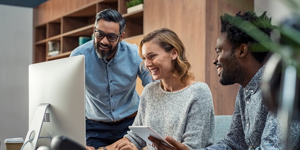 nik-macmillan-YXemfQiPR_E-unsplash|Casual businessmen and cheerful business woman in office working on a project together. Happy busine