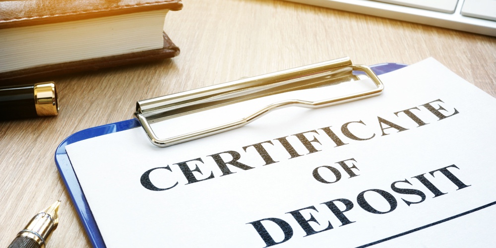 Certificate Of Deposit And Pen On A Desk.