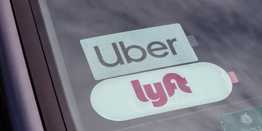 Chicago – Circa June 2019: Uber And Lyft Stickers Displayed. Lyft And Uber Ride Sharing Has Replaced