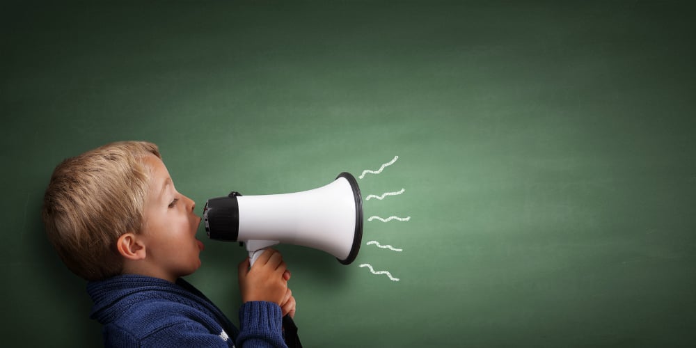 bigstock-Child-speaking-through-a-megap-94099856-1